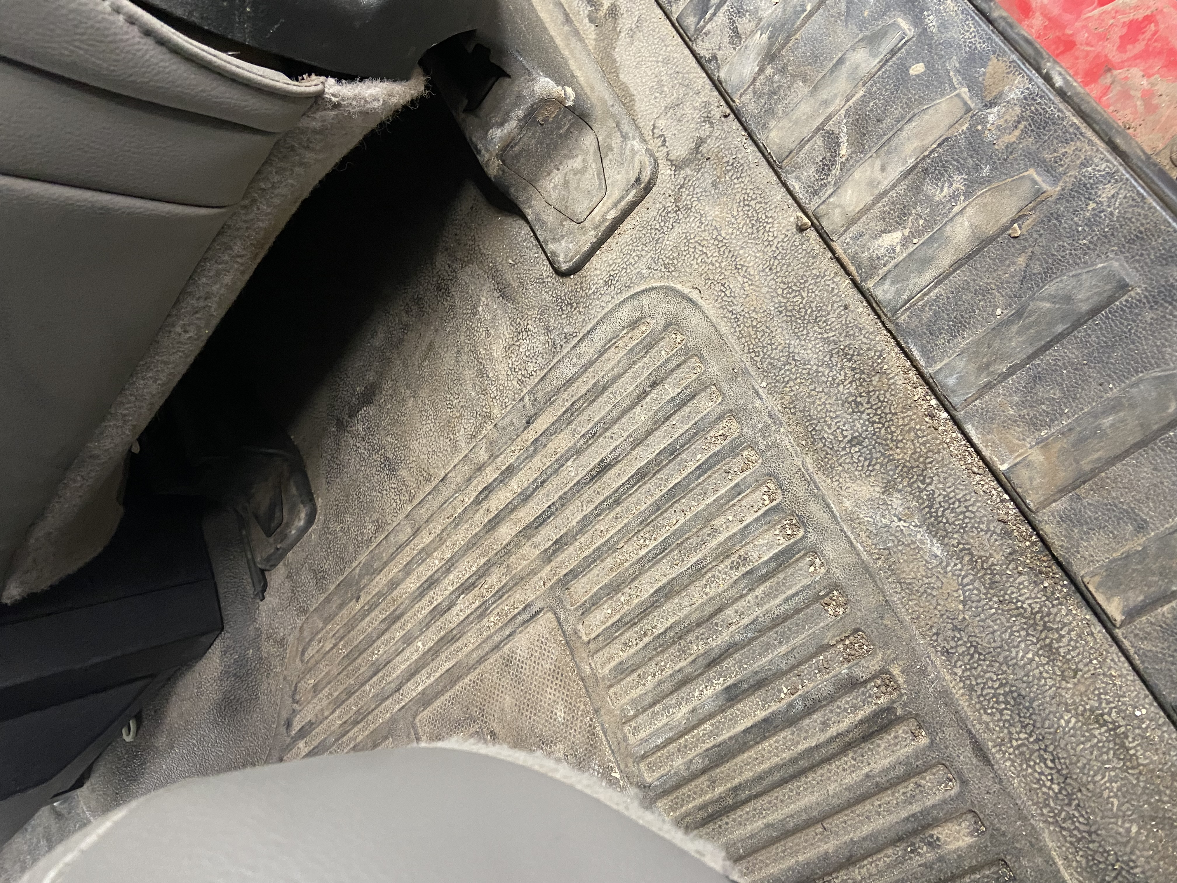 Dirty floor mats before detailing