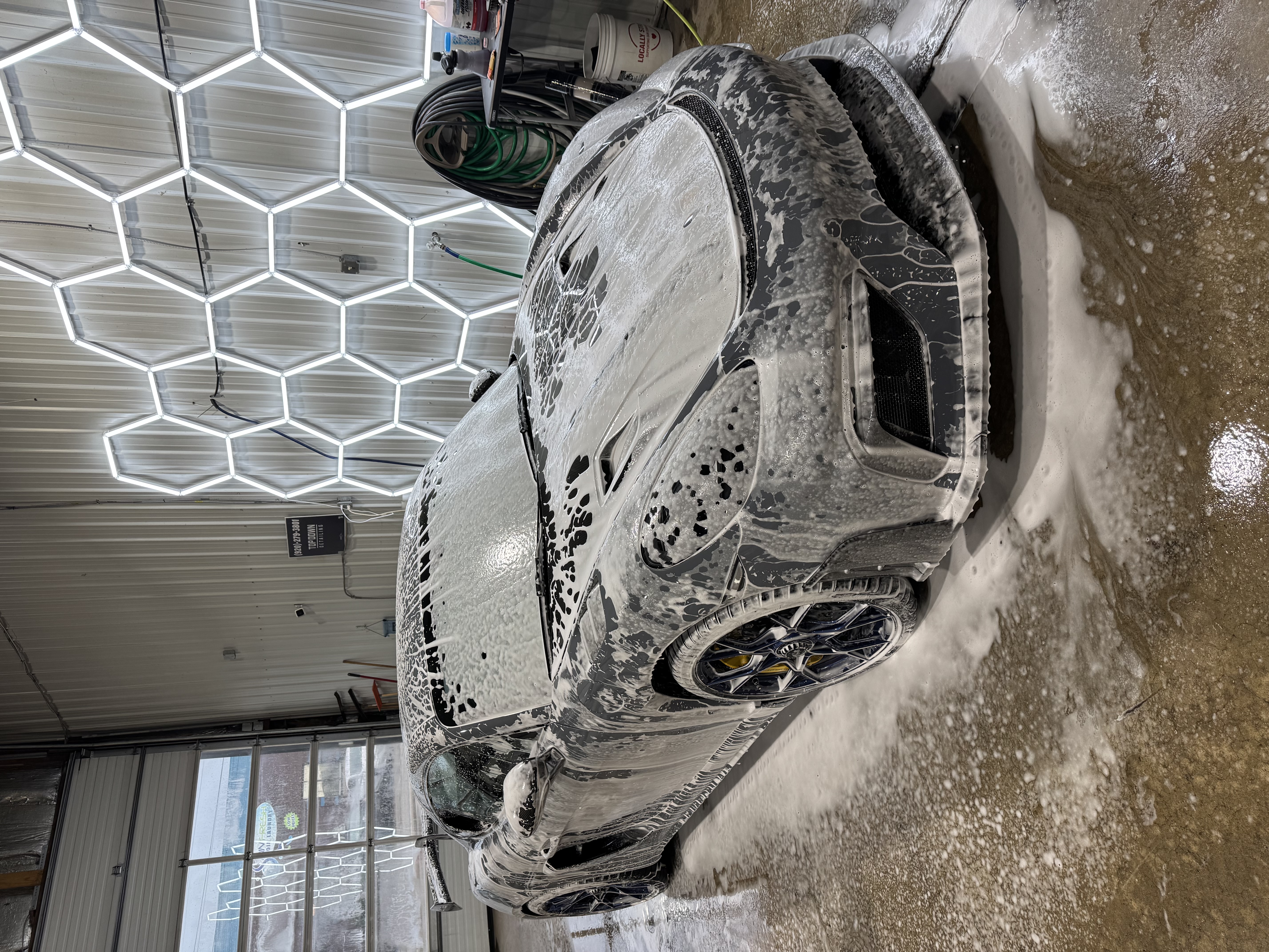 Porsche Cayman GT4 RS covered in foam before detail